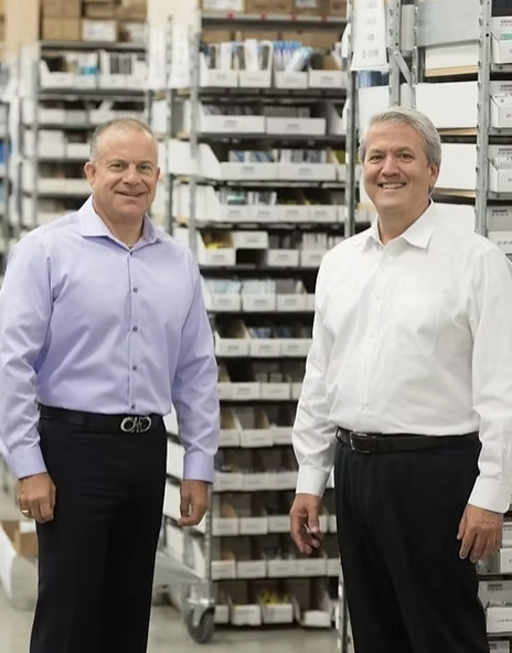 Brad Weinbrum and Angel Alvarez at ABB Optical's distribution warehouse